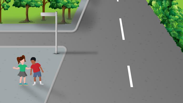 Road junction viewed toward the road ahead, with two children standing on the left pavement.