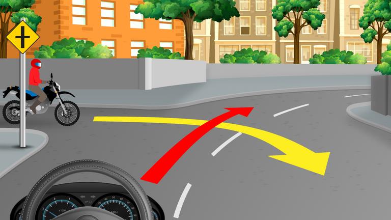 Driver's view of a junction, a cyclist at the left corner, and red and yellow curved route arrows.