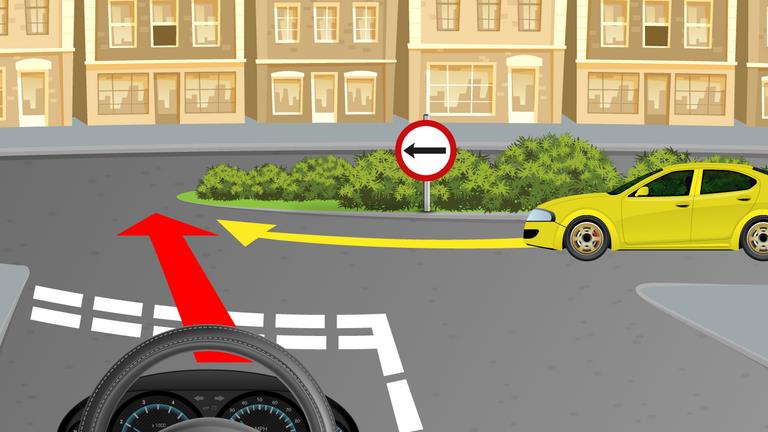 Driver's view at a junction; a yellow car approaches from the right and red and yellow route arrows point left.