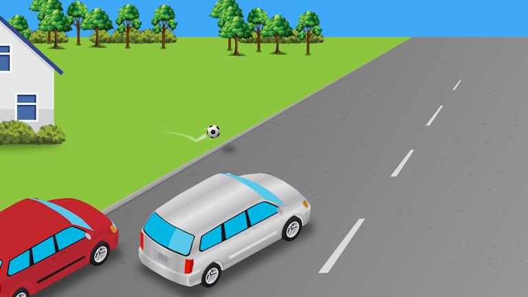 Silver car beside a red parked car on a residential road; a ball is visible on the grass to the left.