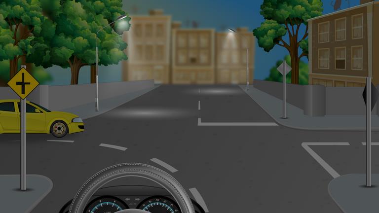 Darkened view of a junction with a yellow car on the left and pale road markings ahead.