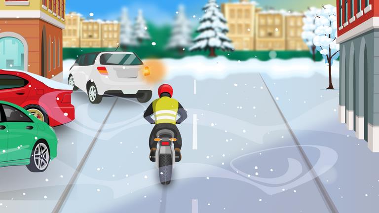 Motorcyclist ahead at a snow-covered junction, with cars at the left and a white vehicle ahead.
