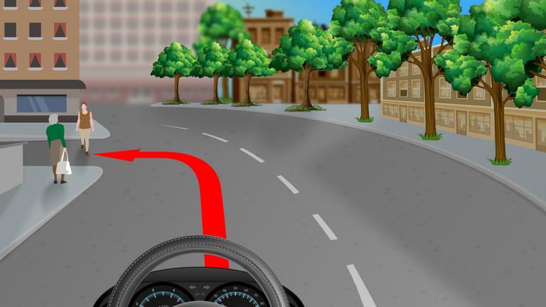 Driver's view approaching a left-hand corner where pedestrians stand at the pavement edge; a red route arrow turns left.