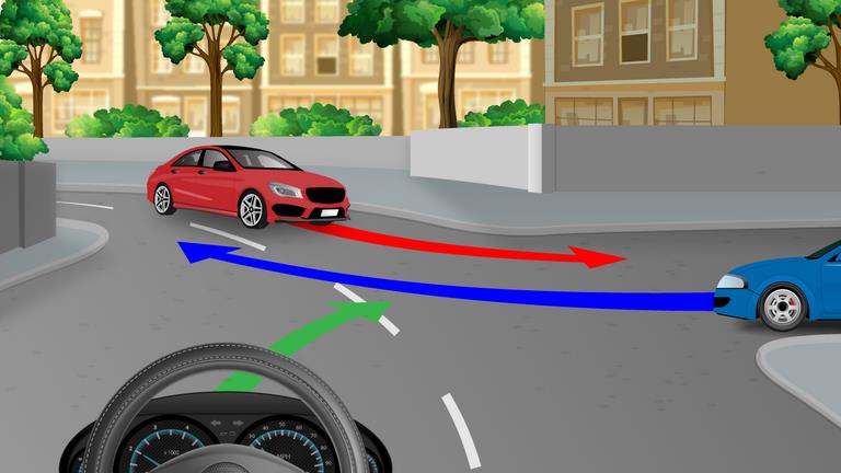 Driver's view at a junction with cars approaching from both sides and red, blue and green route arrows.