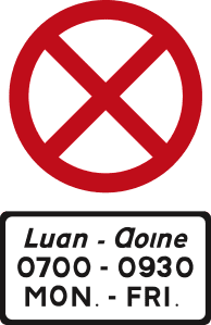 Red-bordered white circle with a red X; plate below reads MON.–FRI., 0700–0930 and Irish wording.