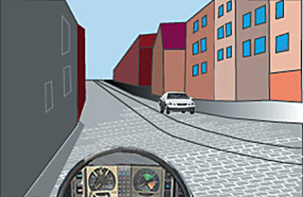 Driver's view along a cobbled street with metal rails, tall buildings and a white car ahead.