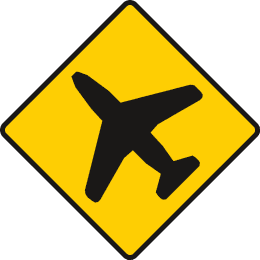 Yellow diamond containing a black aeroplane silhouette.